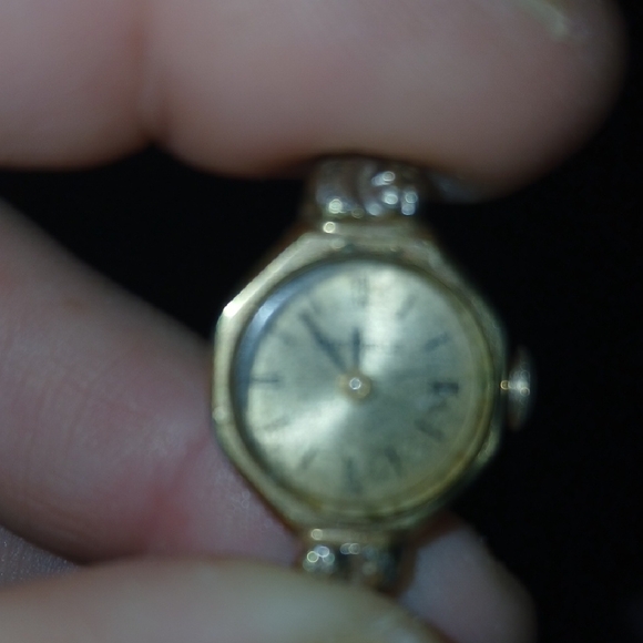 Gold Vintage-Style Wearable Watch with Ornate Design
